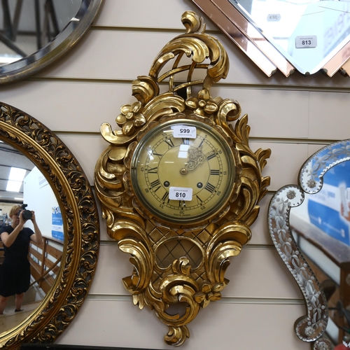 810 - A reproduction gilt-gesso Cartel clock, with 8-day movement, by Exacta, Sweden, height 60cm