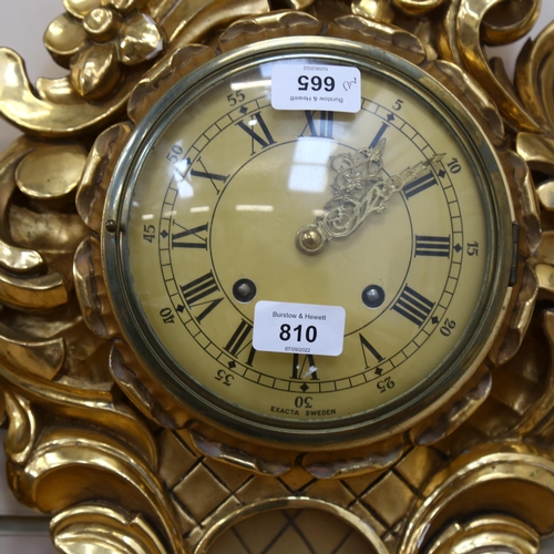 810 - A reproduction gilt-gesso Cartel clock, with 8-day movement, by Exacta, Sweden, height 60cm