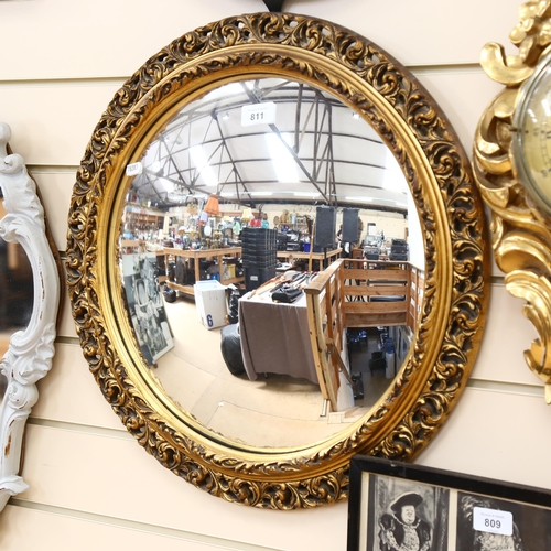 811 - Vintage circular convex wall mirror, in embossed and pierced gilt frame, height 52cm