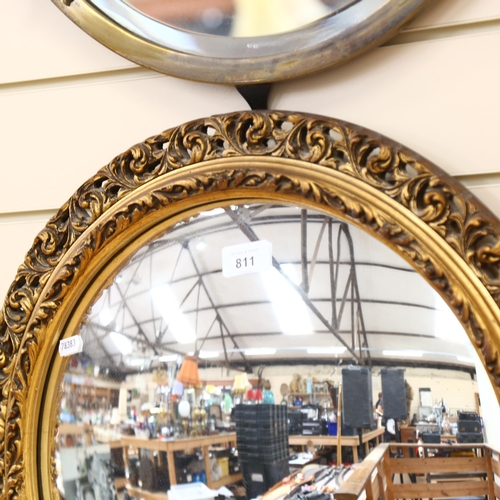 811 - Vintage circular convex wall mirror, in embossed and pierced gilt frame, height 52cm