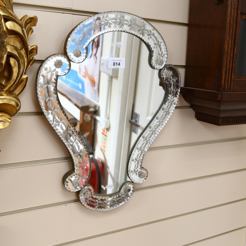 814 - A Venetian style wall mirror, with ornate shaped frame, height 43cm