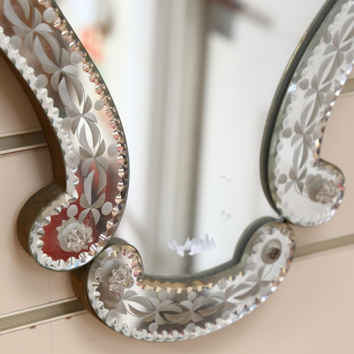 814 - A Venetian style wall mirror, with ornate shaped frame, height 43cm