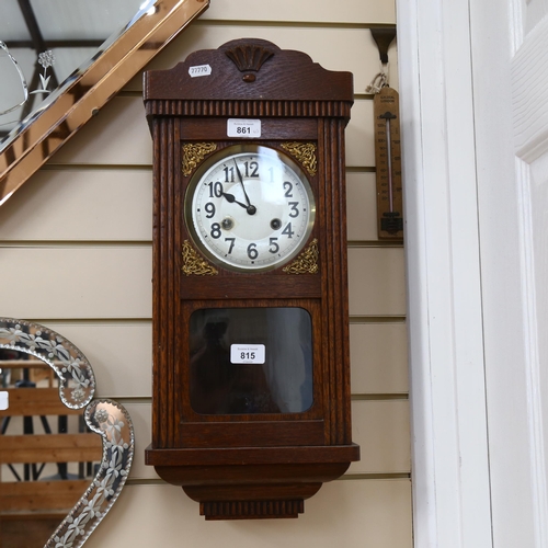 815 - A Vintage stained oak 8-day drop-dial wall clock, case height 55cm, with pendulum