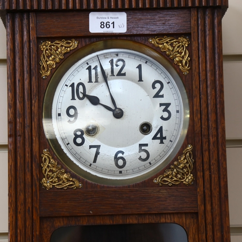 815 - A Vintage stained oak 8-day drop-dial wall clock, case height 55cm, with pendulum