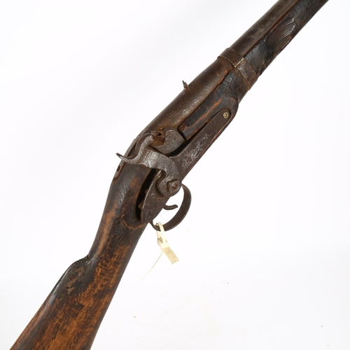 817 - An Antique percussion rifle with ramrod, length 137cm