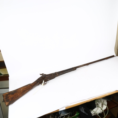 817 - An Antique percussion rifle with ramrod, length 137cm