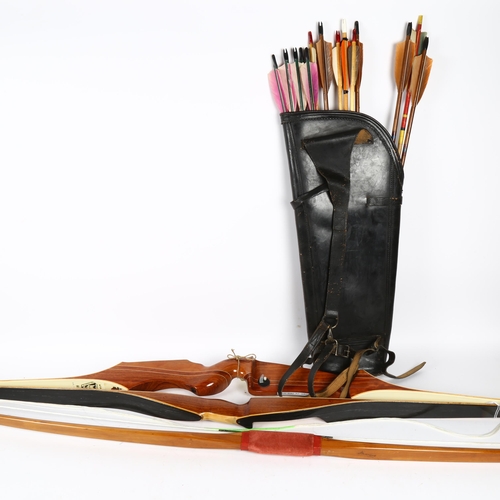 818 - A Marksman stag bow by Les Howis, and 2 other bows, and a quantity of arrows