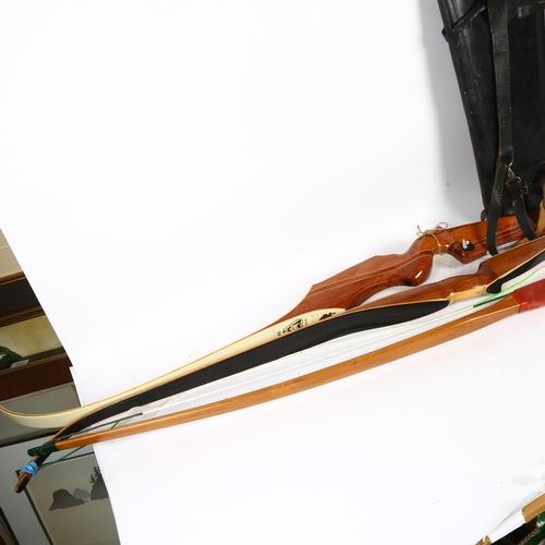 818 - A Marksman stag bow by Les Howis, and 2 other bows, and a quantity of arrows