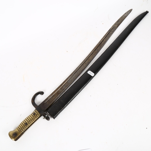 820 - Antique bayonet and scabbard, with turned brass handle, 70cm