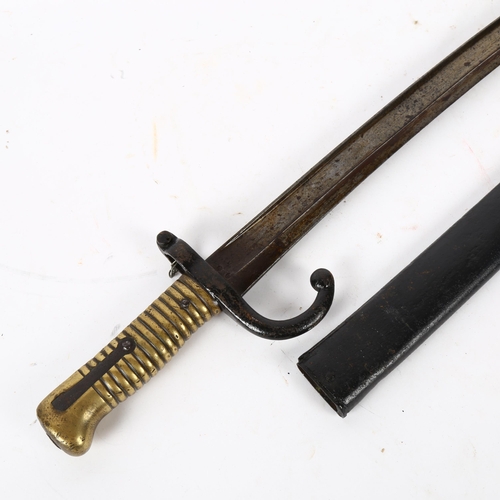 820 - Antique bayonet and scabbard, with turned brass handle, 70cm