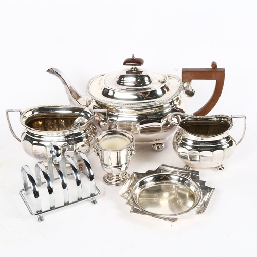 1002 - A silver plated 3-piece tea set, sugar tongs, toast rack etc