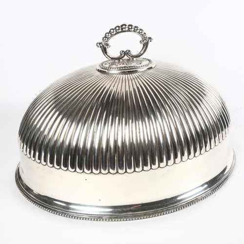 1014 - A large silver plated meat cover, half fluted form, height 28cm, width 48cm