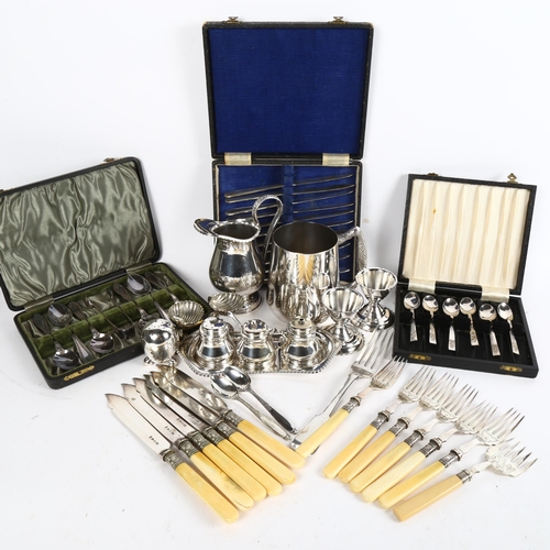 1015 - A group of silver plated items, to include cased cutlery, cruet set, shell design salts etc