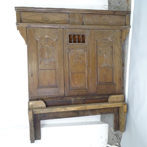 2500 - An Antique 17th century style oak double bed, with carved and panelled decoration, head board dimens... 