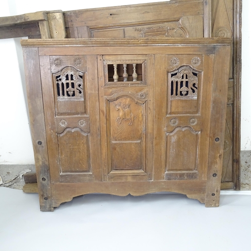 2500 - An Antique 17th century style oak double bed, with carved and panelled decoration, head board dimens... 