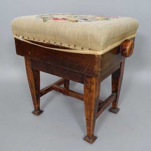 2511 - An Arts and Crafts mahogany rise and fall piano stool, with embroidered seat, on square tapered legs... 