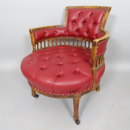 2514 - An Antique mahogany circular seated desk chair, with button-backed rexine upholstery