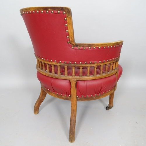 2514 - An Antique mahogany circular seated desk chair, with button-backed rexine upholstery