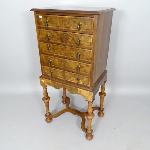 2517 - A reproduction burr-walnut and ebony-strung 1-section chest on stand/music cabinet, having 5 fall-fr... 