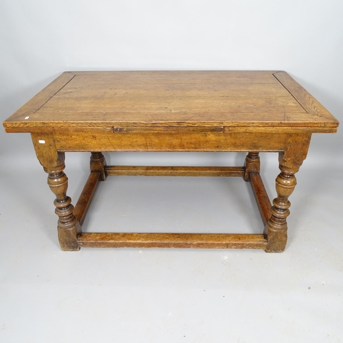 2518 - A 19th century oak draw leaf dining table, on turned legs, with all round stretcher, 136cm (extendin... 