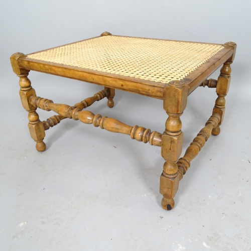 2521 - An Antique mahogany cane-seated footstool, 61cm x 40cm x 52cm