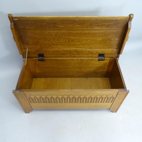 2523 - A modern contemporary light oak blanket box, with carved linenfold decoration, 99cm x 50cm x 48cm