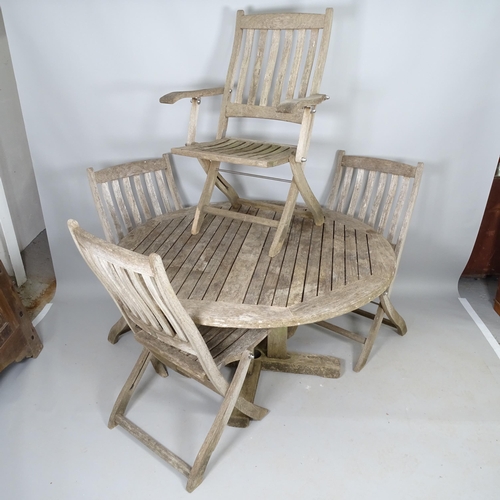 2527 - A weathered teak circular-topped garden table, with 5 matching chairs, with label for F. Peart & Com... 