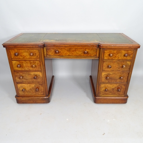 2530 - A Victorian walnut kneehole writing desk, with 9 fitted drawers and tooled and embossed green leathe... 