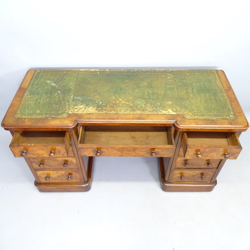 2530 - A Victorian walnut kneehole writing desk, with 9 fitted drawers and tooled and embossed green leathe... 