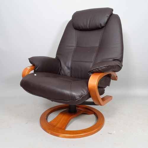 2541 - A contemporary faux leather upholstered reclining swivel lounge chair