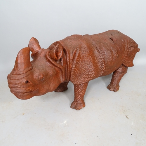 2551 - A carved wooden sculpture of a rhino, L110cm (WITH THE OPTION TO PURCHASE THE FOLLOWING LOT)