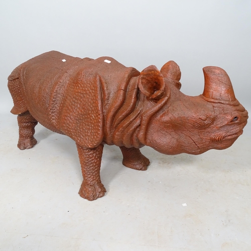 2551 - A carved wooden sculpture of a rhino, L110cm (WITH THE OPTION TO PURCHASE THE FOLLOWING LOT)