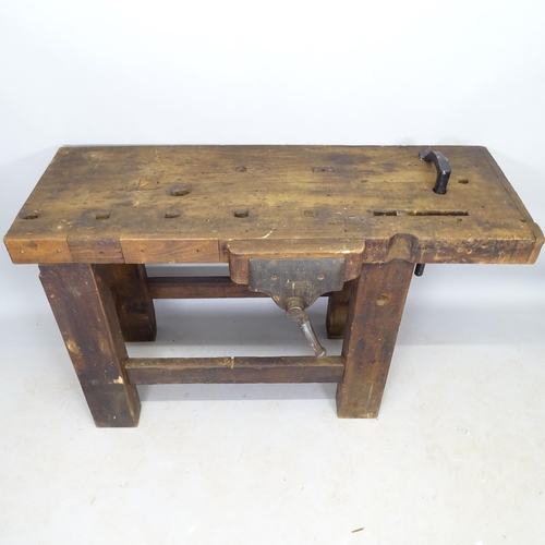 2571 - A Vintage stained pine work bench with fitted vice, 130cm x 78cm x 46cm