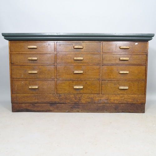 2601 - An early 20th century mahogany bank of 16 drawers, with painted wooden top, 153cm x 84cm x 52cm