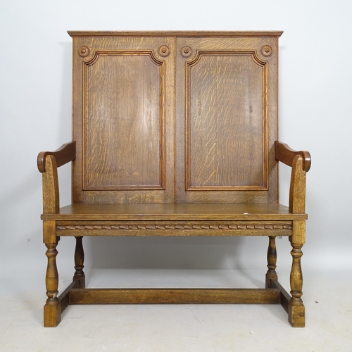 2606 - An early 20th century oak hall settle, 95cm x 116cm x 40cm