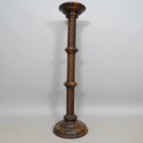 2610 - A stained oak torcher with spiral turned column, H101cm