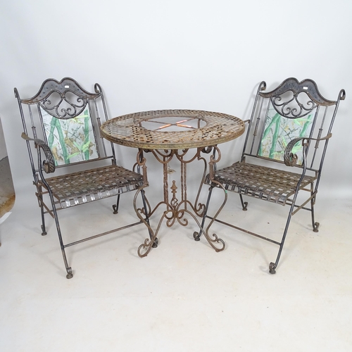 2619 - A pair of wrought-iron folding garden chairs, and a similar wrought-iron circular-top garden table, ... 