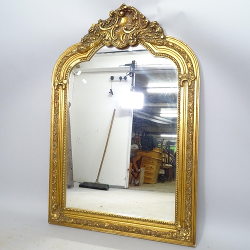 2635 - A modern gilt painted wall mirror in resin frame, 79cm x 118cm