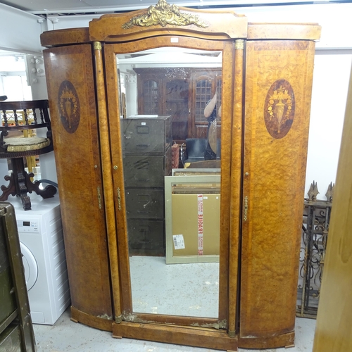 2638 - An Antique Continental crossbanded figured walnut armoire, with central bevel-mirror door, flanked b... 