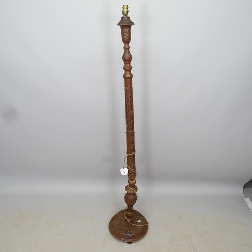 2667 - A carved Oriental hardwood standard lamp, height to bayonet 160cm