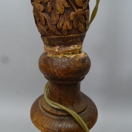 2667 - A carved Oriental hardwood standard lamp, height to bayonet 160cm