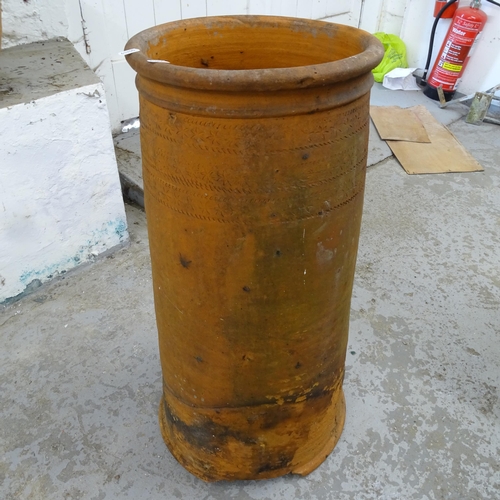 2677 - A terracotta chimney pot, 33cm x 77cm