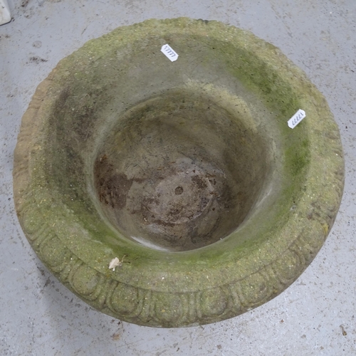 2683 - A weathered concrete garden urn, 41cm x 38cm