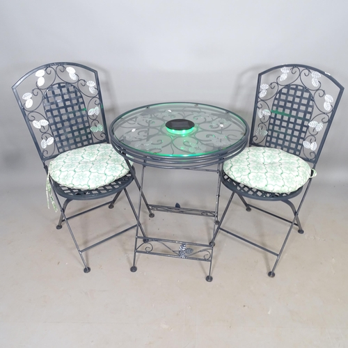 2697 - A modern glass-top circular bistro garden table, with 2 folding chairs, 60cm x 70cm