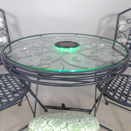 2697 - A modern glass-top circular bistro garden table, with 2 folding chairs, 60cm x 70cm