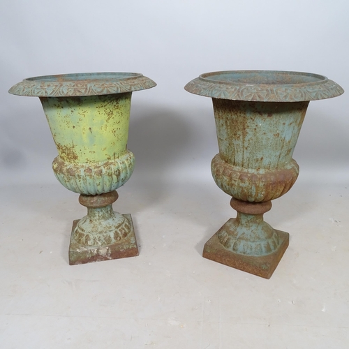 2701 - A pair of weathered cast-iron Campana urns, 50cm x 70cm