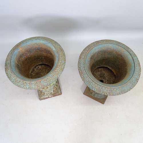 2701 - A pair of weathered cast-iron Campana urns, 50cm x 70cm