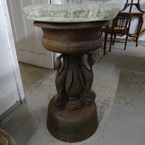 2722 - A heavy cast-iron water fountain with heron adorned column and stone topper.