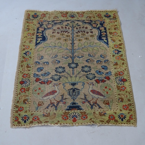 2416 - A Tree of Life design red ground rug, 125cm x 90cm