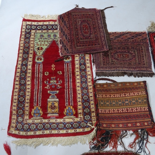 2418 - A group of Antique Turkish and Persian saddle bags, mats and wall hangings (7)